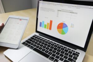 Laptop with charts on the screen