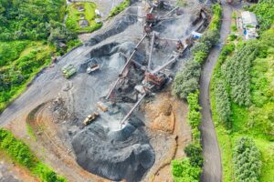 A mining complex overhead shot, with pit and heavy mining machinery, not actually how Bitcoins are mined